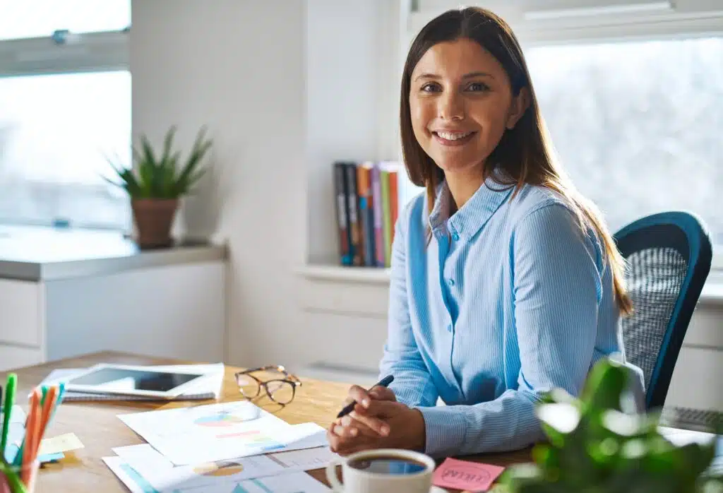 Smiling professional woman working at home